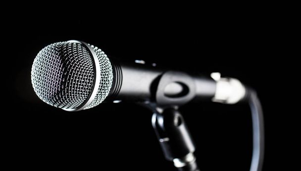 Microphone, mic, karaoke, concert, voice music. Vocal audio mic on a bleck background. Singer in karaokes, microphones. Live music, audio equipment. Closeup microphone. Karaoke concert, sing soun - Photo, Image