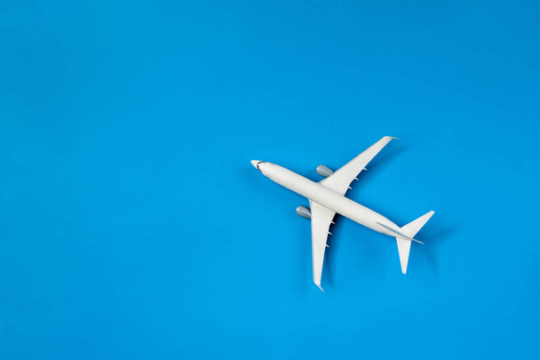 Picture of airplane isolated on empty blue background - Zdjęcie, obraz