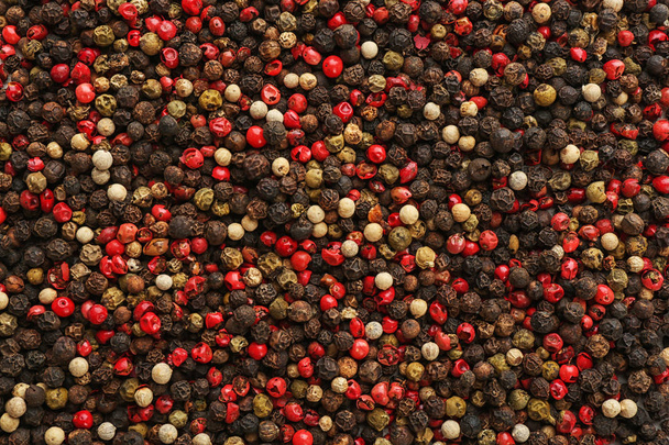 Different types of pepper as background. Natural spice - Foto, Imagen