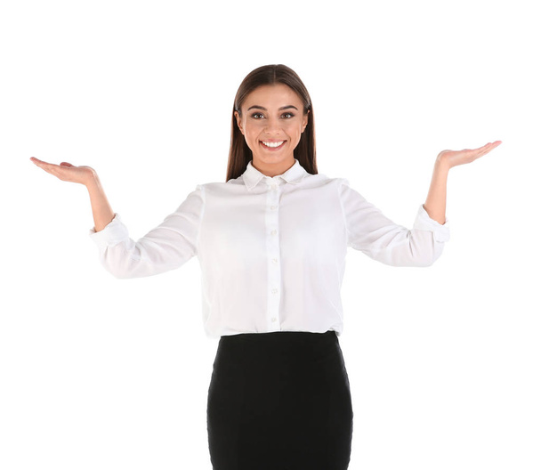 Portrait of businesswoman showing balance gesture on white background - Foto, Imagen