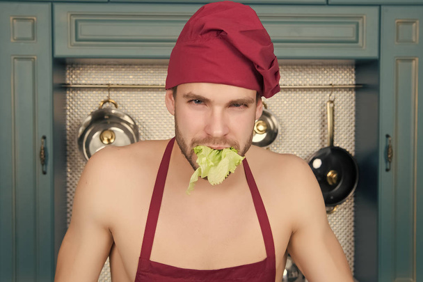 Guy hold salad leaf in mouth - Fotografie, Obrázek