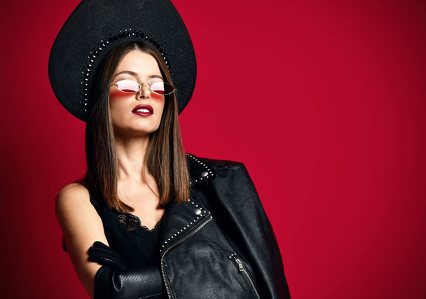 Brunette woman with mustaches in new brown modern fashion sunglasses - 写真・画像