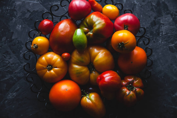 Tomatoes on a gray background, healthy food, vegetables - Photo, image