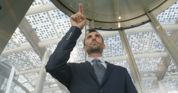 businessman in suit touching with finger hologram, slow motion video - Filmagem, Vídeo
