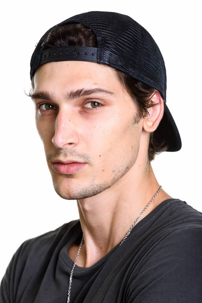 Face of young handsome man wearing snapback  - Photo, Image