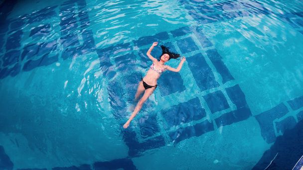 Aerial view of lying on water surface in big swimming pool - Foto, Imagem