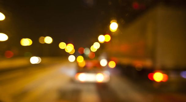 View of blurred road with cars and lights at night  - Fotó, kép