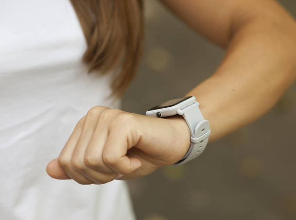 Smart watch on the woman's hand - Фото, изображение