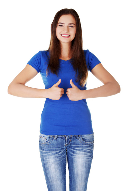 Young student woman gesturing OK - Foto, immagini