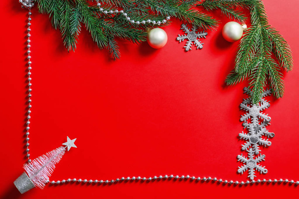 Frame made of beautiful Christmas decorations on color background - Valokuva, kuva