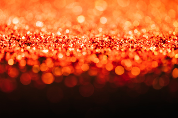クリスマスの背景にオレンジ色のキラキラ ボケ味を抽象化します ロイヤリティフリー写真 画像素材