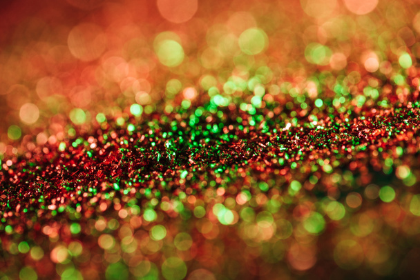 glowing christmas texture with colorful blurred glitter - Photo, Image