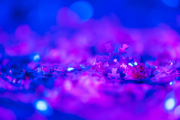 christmas background with glowing ultra violet glitter and decorative snowflake - Foto, afbeelding
