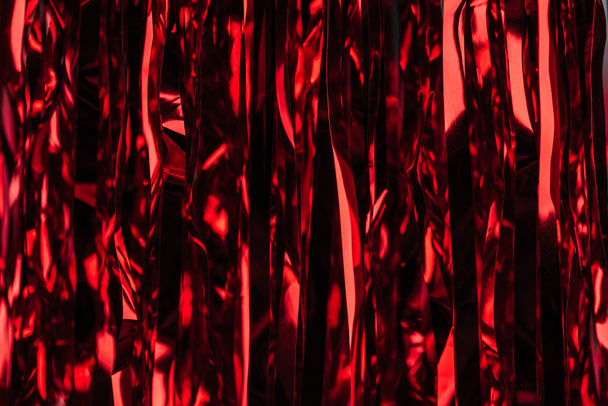 celebration red shiny serpentine as christmas background - Foto, Bild