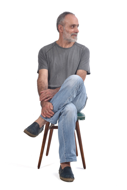 portrait of middle aged man sitting  on white - Photo, Image