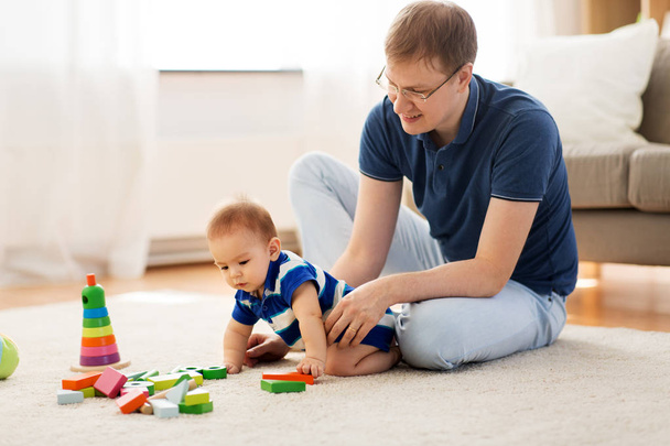 happy father with baby son playing toys at home - Foto, Imagem