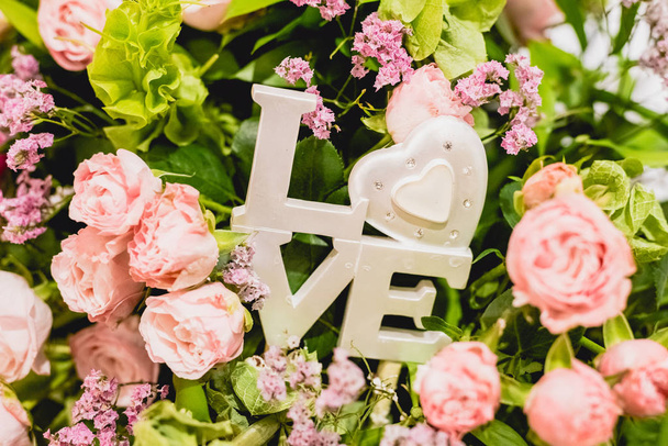 Word Love in wooden letters to decorate a wedding. - Photo, Image