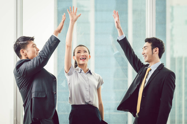 Businesspeople raising hands - Photo, Image