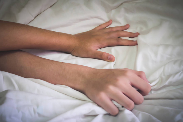 Hands of couple lover sex on the bed,Concept about love, sex and lifestyle. - 写真・画像