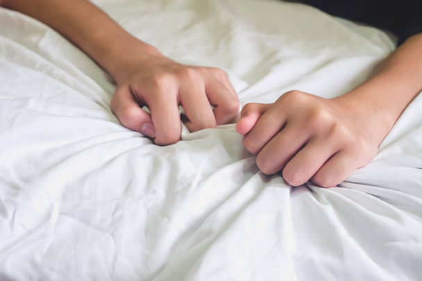 Hands of couple lover sex on the bed,Concept about love, sex and lifestyle. - Foto, Imagem