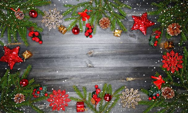 christmas background and decoration with fir branches snow garland lights on old wooden board copy space - Photo, Image