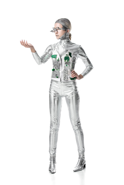 silver cyborg holding something isolated on white, future technology concept - Zdjęcie, obraz