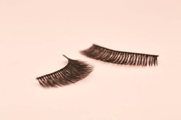 Eyelashes are on pink background soft selective focus. Empty space for design - Photo, Image