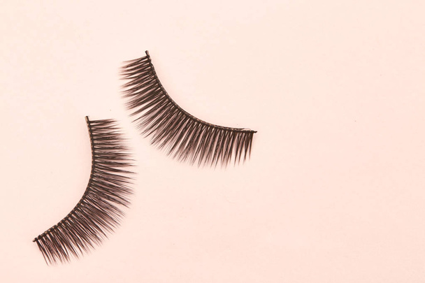 Eyelashes are on pink background soft selective focus. Empty space for design - Photo, Image