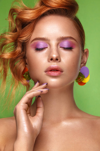 Beautiful girl with unusual accessories and make-up on a bright background. Beauty face. - Fotó, kép