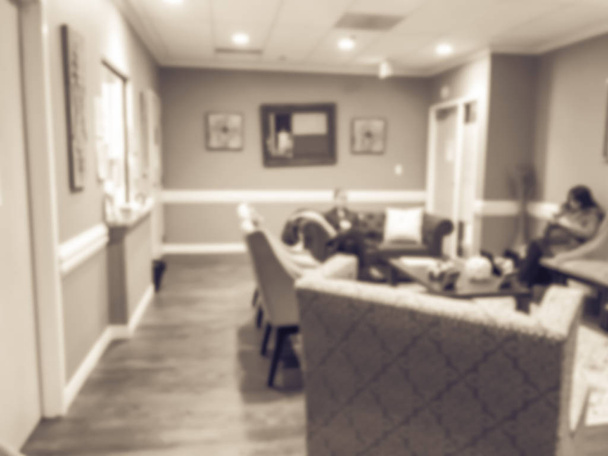 Vintage tone blurred abstract patients waiting at Obstetrics Gynecology. Defocused medical center hospital office, medical clinic family practice primary care in America - Photo, Image