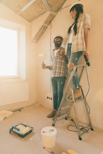 happy young couple making renovation of home together - 写真・画像