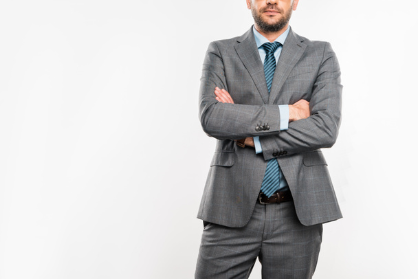 cropped shot of confident businessman standing with crossed arms isolated on white - Φωτογραφία, εικόνα