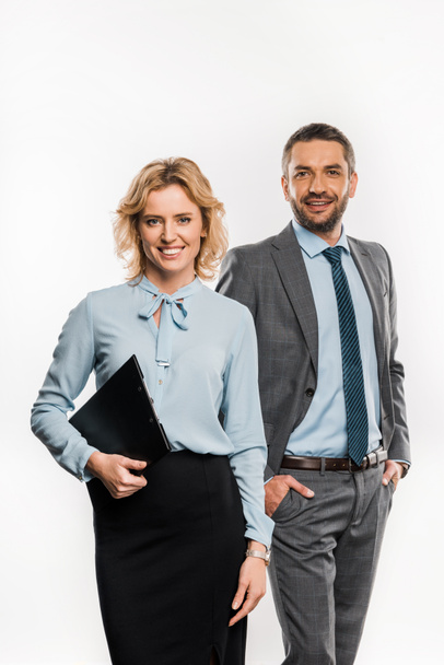 businessman and businesswoman in formal wear standing together and smiling at camera isolated on white   - Valokuva, kuva