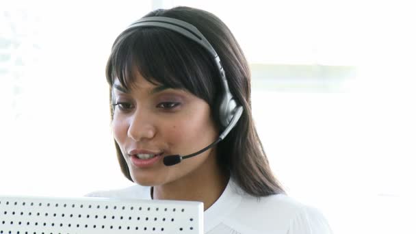 Pretty business woman working in a call centre - Materiaali, video