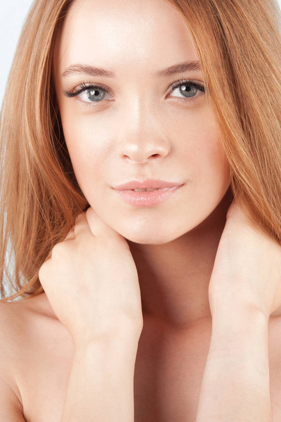 Young beautiful girl with clean perfect skin close-up. Beauty and care for young skin - Foto, imagen