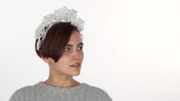 Happy young woman laughing joyfully, wearing snowflakes headband - Footage, Video