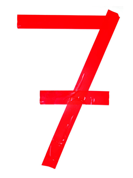 Numeral 7 symbol made of red tape pieces, isolated on the white background - Photo, Image