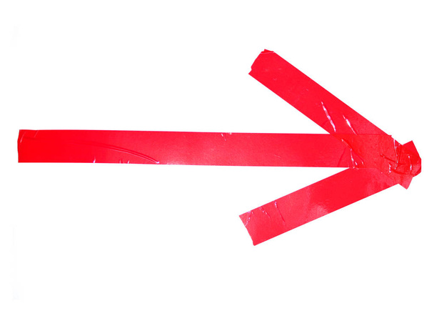 Символ стрелки буквы Х из изолированных на белом фоне кусочков скотча
 - Фото, изображение