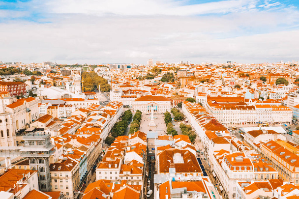 Aerial view of the Lisbon old town center with main street going straight to the Commerce square by the bay. - Fotoğraf, Görsel
