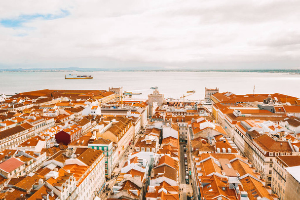 Aerial view of the Lisbon old town center with main street going straight to the Commerce square by the bay. - Photo, Image