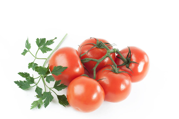 ripe tomatoes on a branch .isolated white background. - Fotó, kép
