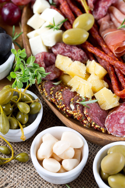 Antipasti and catering platter with different meat and cheese products - Fotoğraf, Görsel