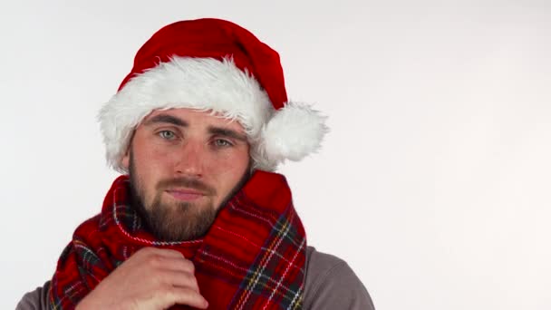 Young man in Christmas Santa hat looking upset - Záběry, video