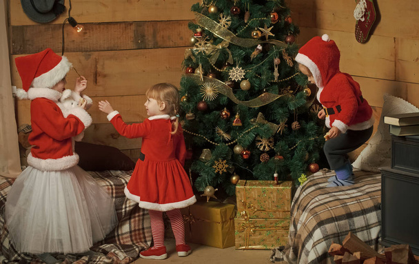Christmas happy children in red hat. - Foto, Bild