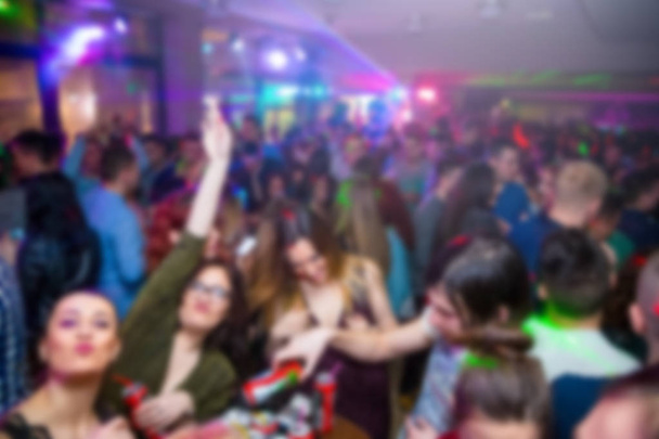 blurred scene of young people in night club at party . - Photo, Image
