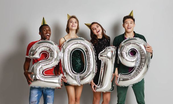 new Year party. company of cheerful friends with ballonss numbers 201 - Photo, Image