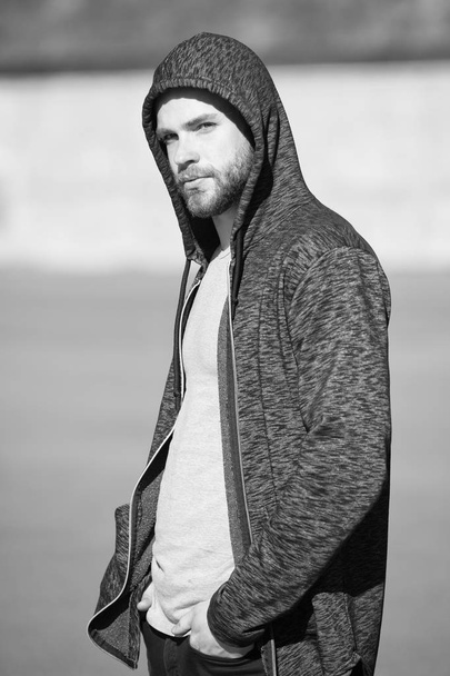 New day for achievements. Man handsome hooded guy enjoy sunrise after morning walk. Man feel motivated for new achievements. Sunny morning fill him energy charge. Motivation and inspiration concept - Foto, Bild