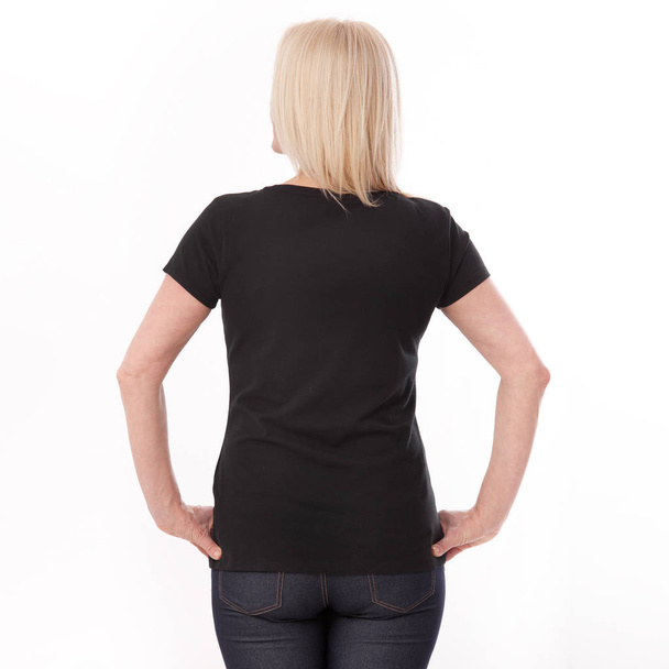 T-shirt design and people concept - close up of woman in blank black t-shirt, shirt rear isolated. Mock up. - Zdjęcie, obraz