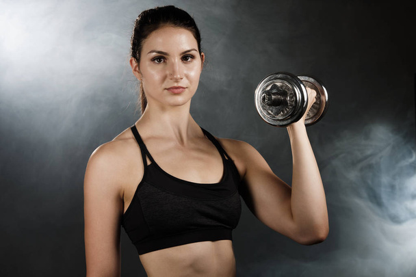 Active young sporty hispanic woman workout with dumbbells isolateda - Fotoğraf, Görsel