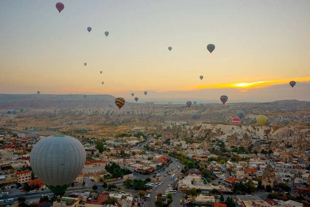 The great tourist attraction of Cappadocia - balloon flight. Cappadocia is known around the world as one of the best places to fly with hot air balloons. Goreme, Cappadocia, Turkey. - Fotó, kép